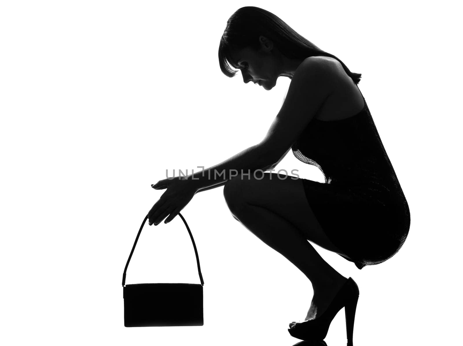 stylish silhouette caucasian beautiful woman crouching thinkig despair full length on studio isolated white background