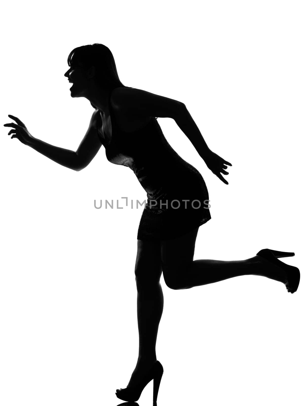 stylish silhouette caucasian beautiful woman running happy full length on studio isolated white background