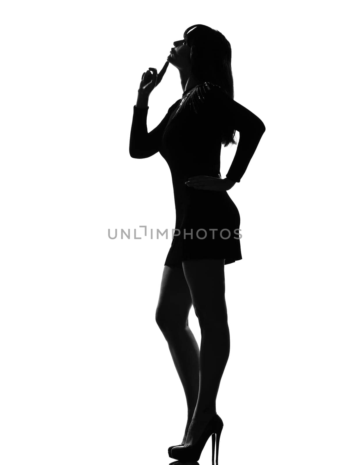 stylish silhouette caucasian beautiful woman thinking pensive looking up full length thinking pensive on studio isolated white background