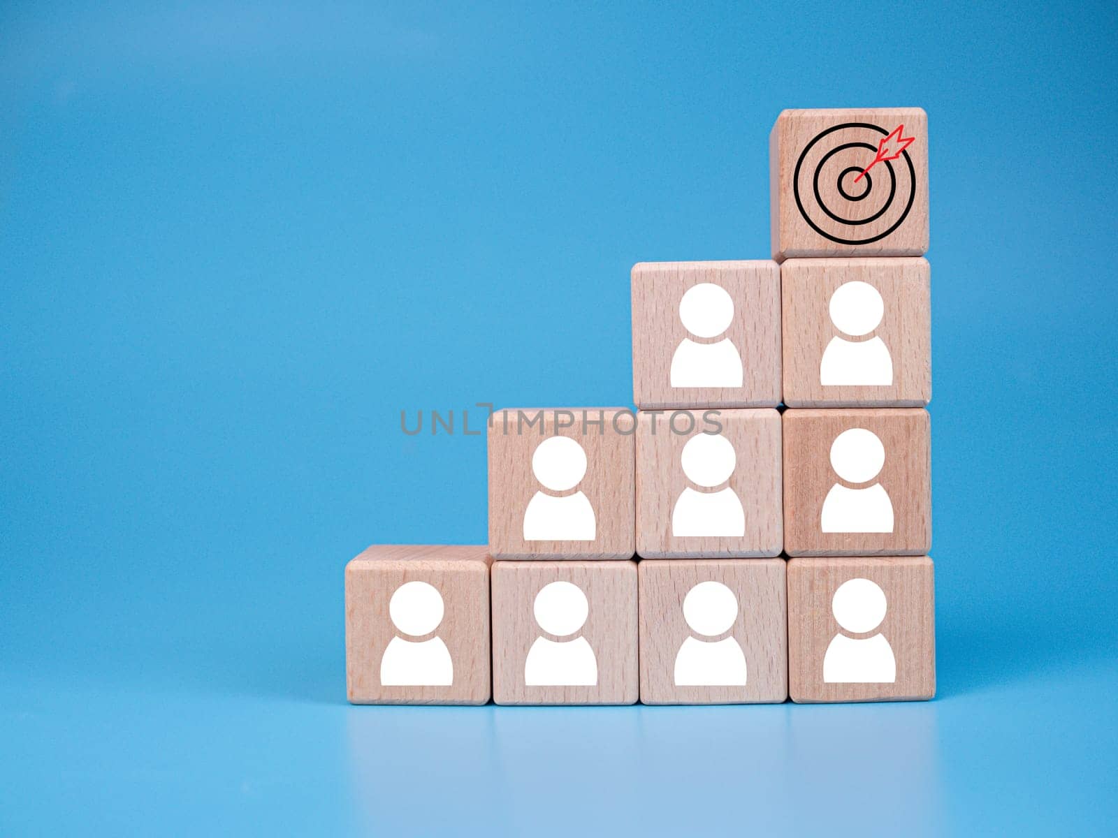 wooden block which prints a target icon and business symbol on white background. Business goals and objectives concept. business competition. business target concept. by Unimages2527