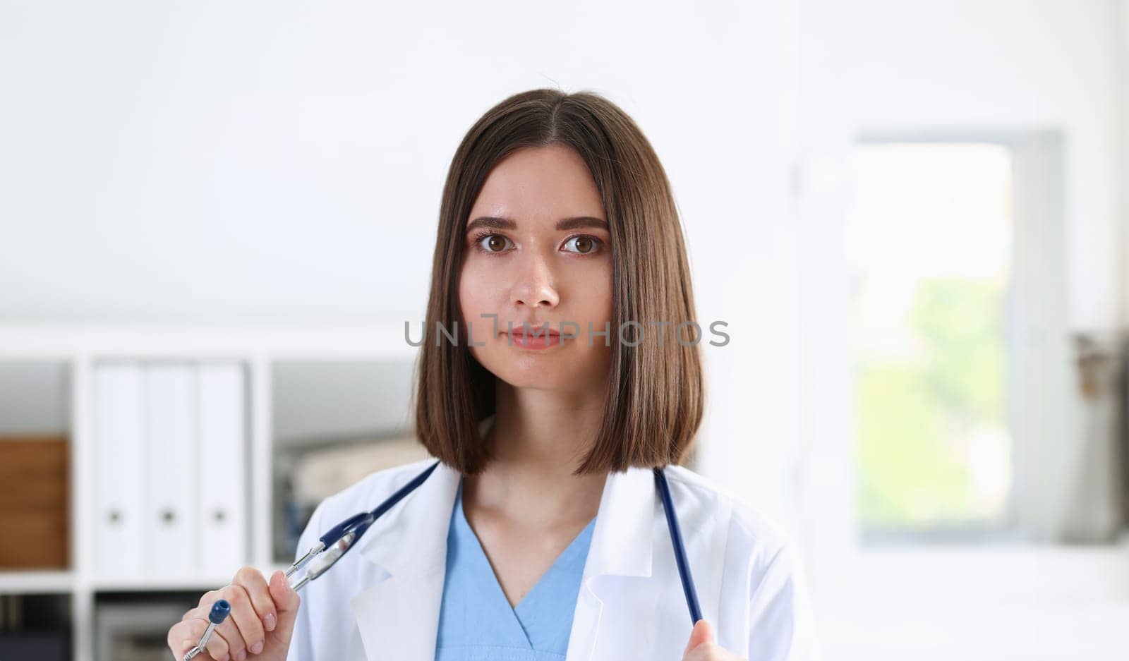 Beautiful smiling female doctor stand in office portrait. Physical and patient disease prevention exam er ward round 911 prescribe remedy healthy lifestyle consultant nurse profession concept