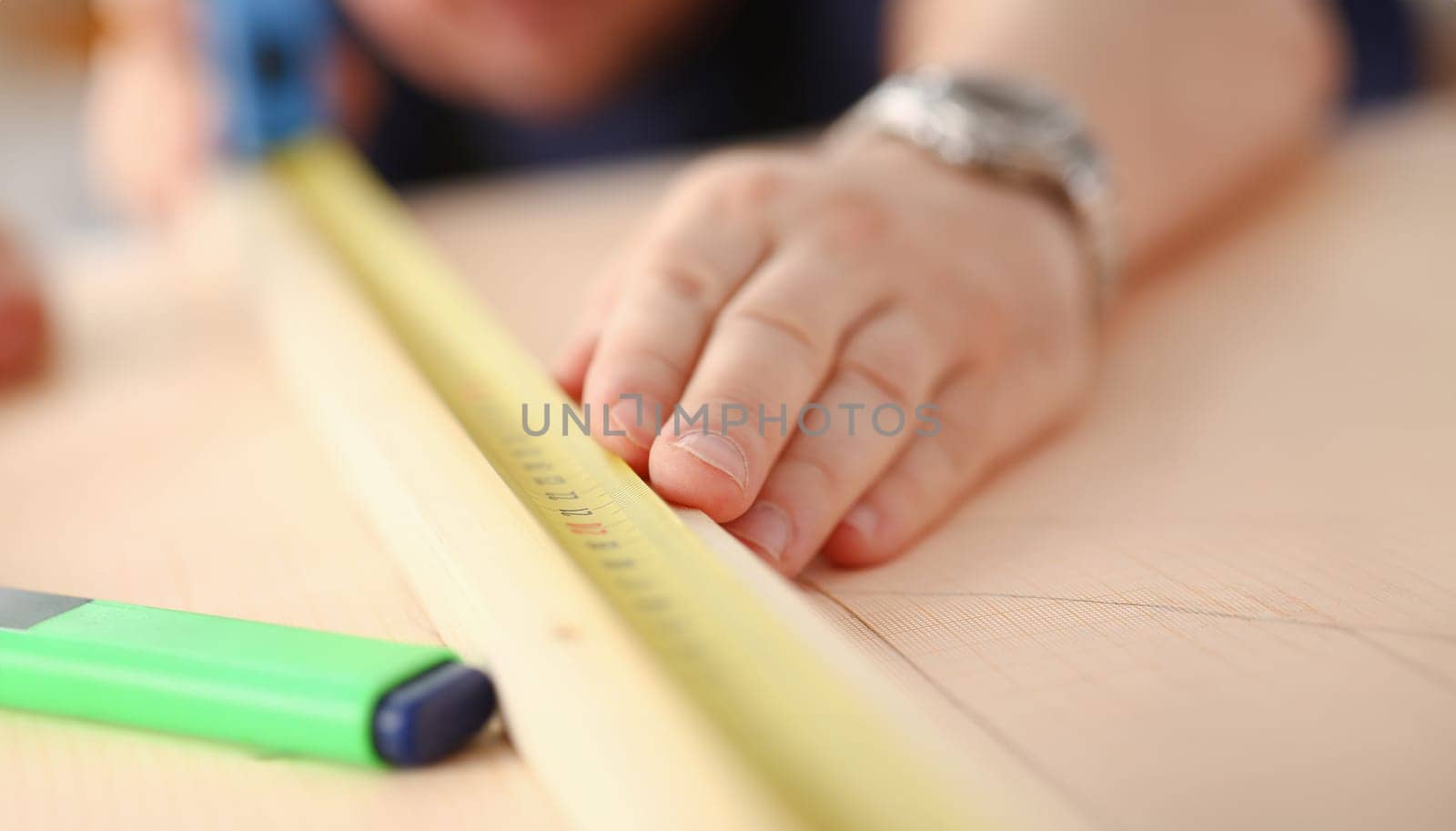 Arms of worker measuring wooden bar portrait. Manual job DIY inspiration improvement job fix shop yellow helmet joinery startup workplace idea hard hat career ruler industrial education