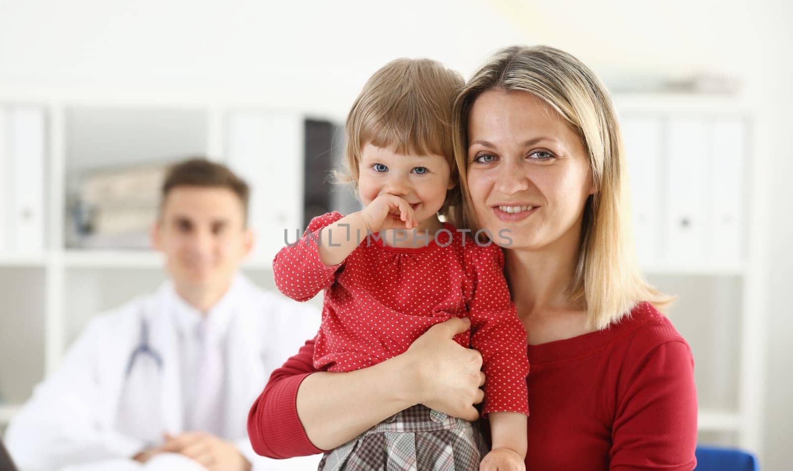 Little child with mother at pediatrician reception. Physical exam cute infant portrait baby aid healthy lifestyle ward round child sickness clinic test high quality and trust concept