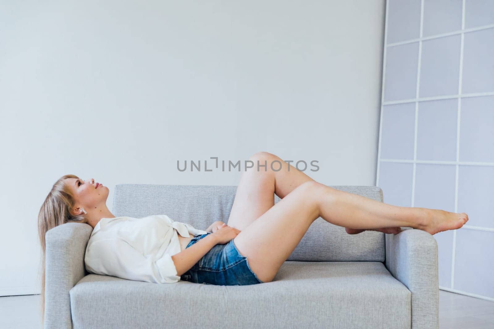 woman lying on the couch in the room