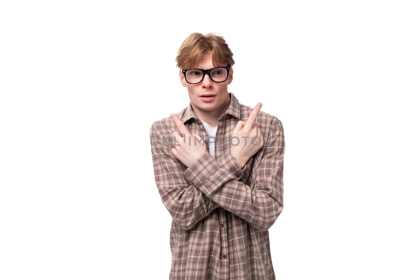 young european promoter man with golden hair in glasses and a shirt gesturing on a white background.