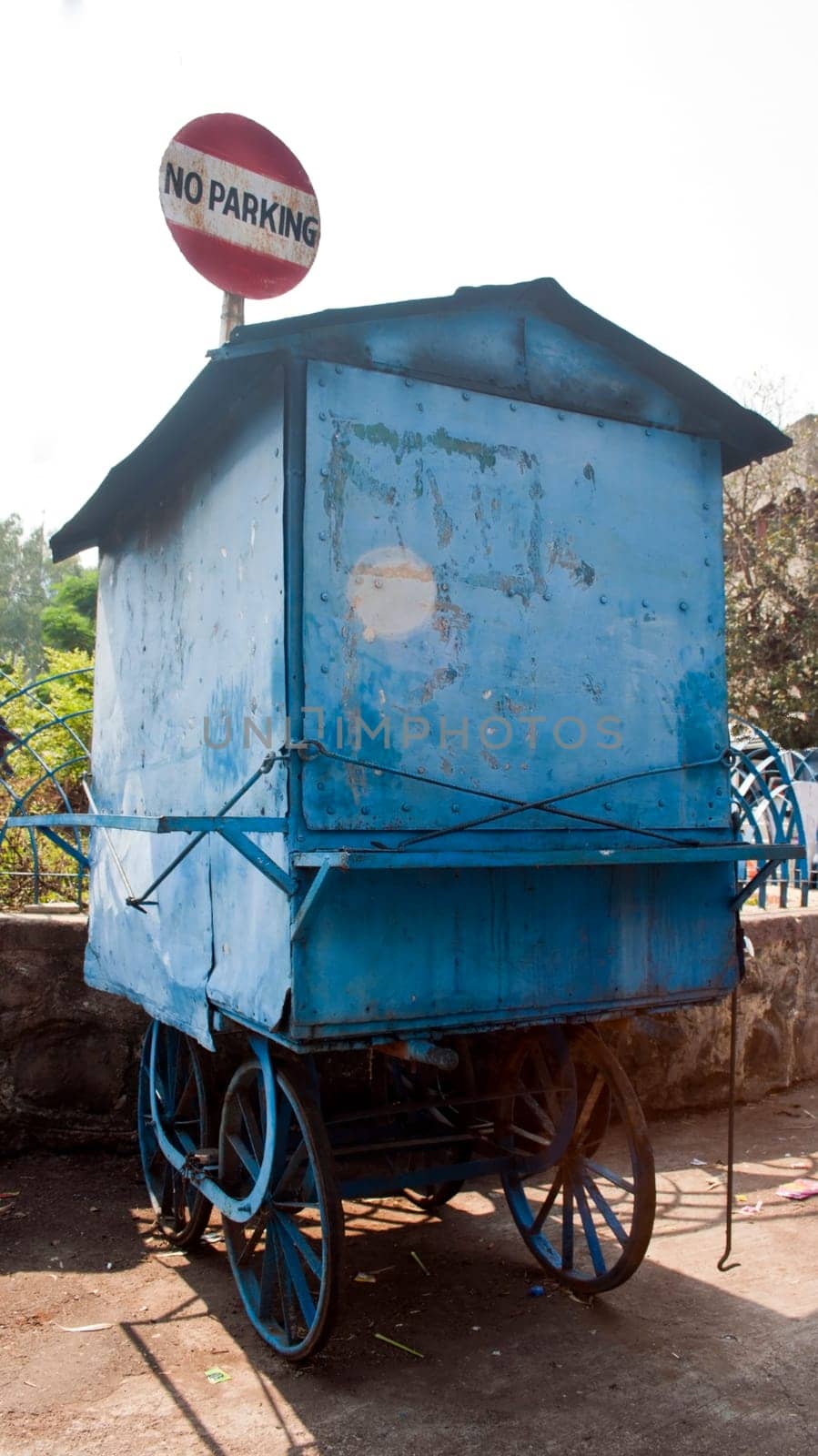 vendor parked under a no parking sign at bhimashankar india