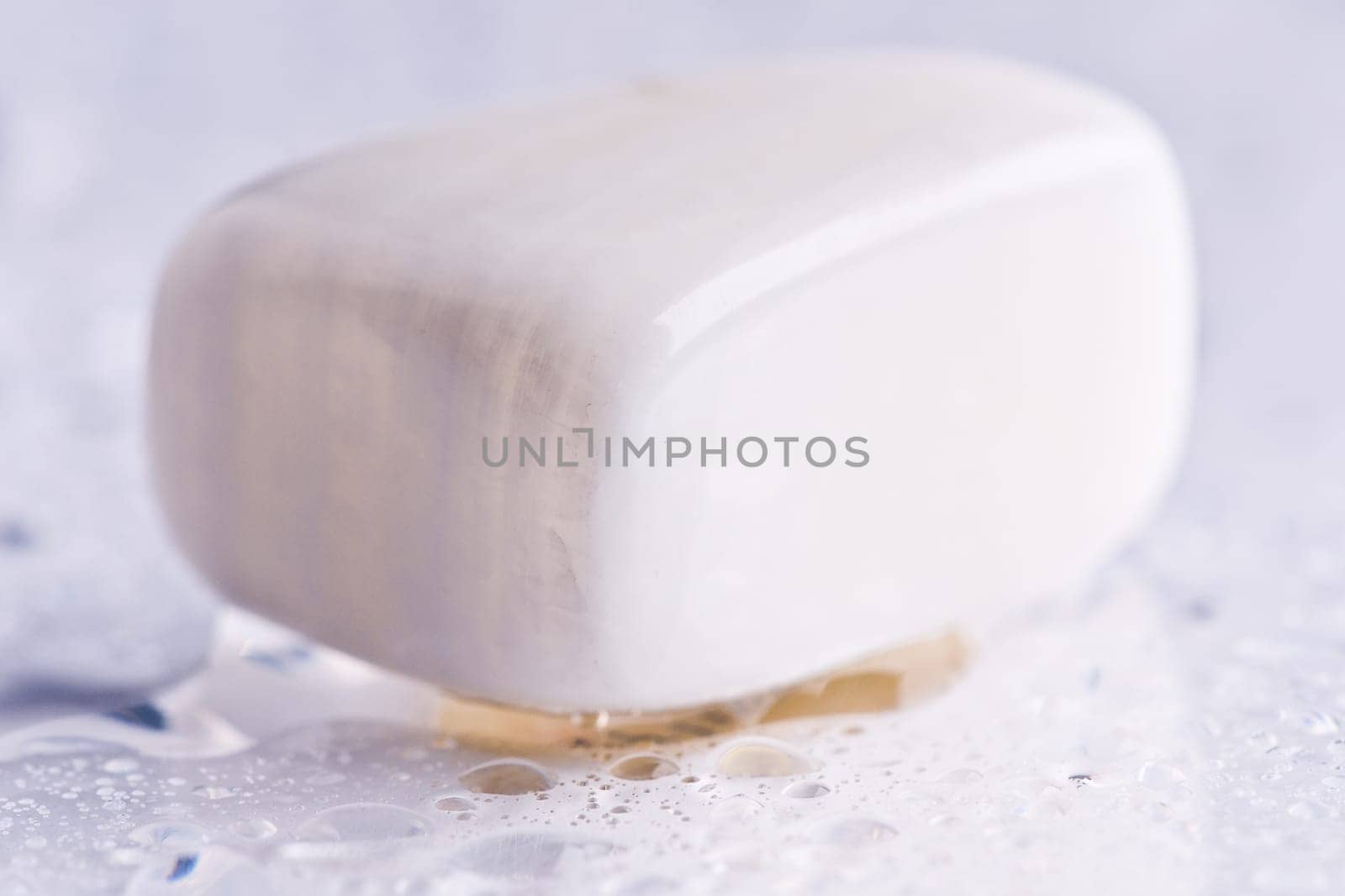 Natural stone mother-of-pearl shines in beautiful colors on a white background