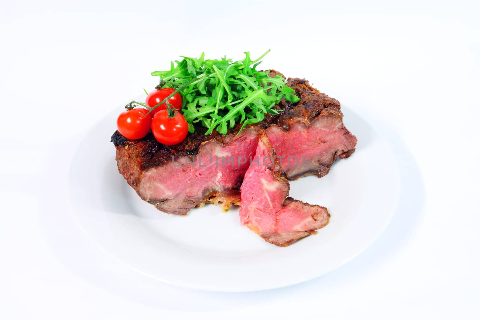 Roastbeef with gherkin and hot pepper on white background