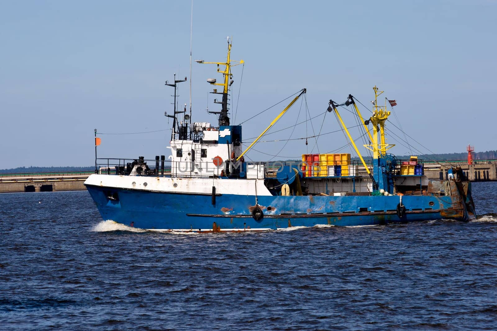 fishing ship in port going to the sea