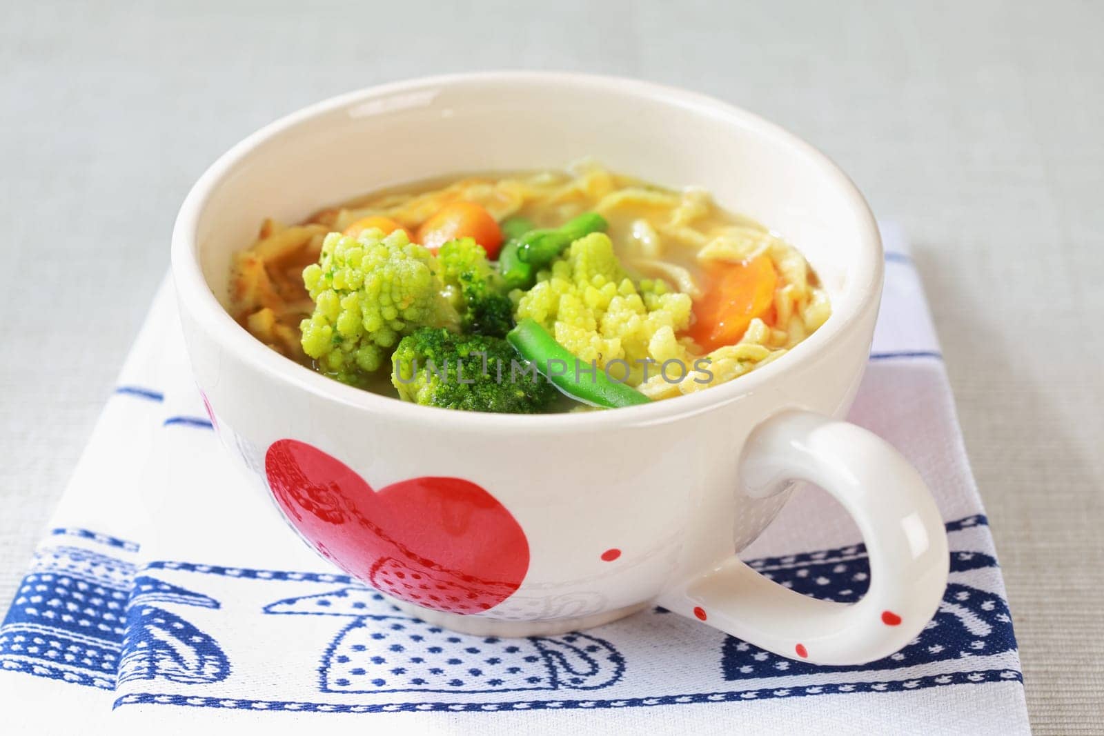 Chicken noodle soup with sorted vegetable