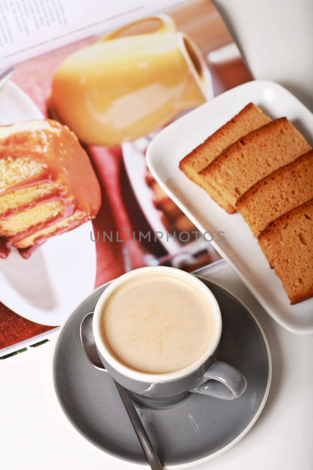 Delicious coffee with milk and biscuits