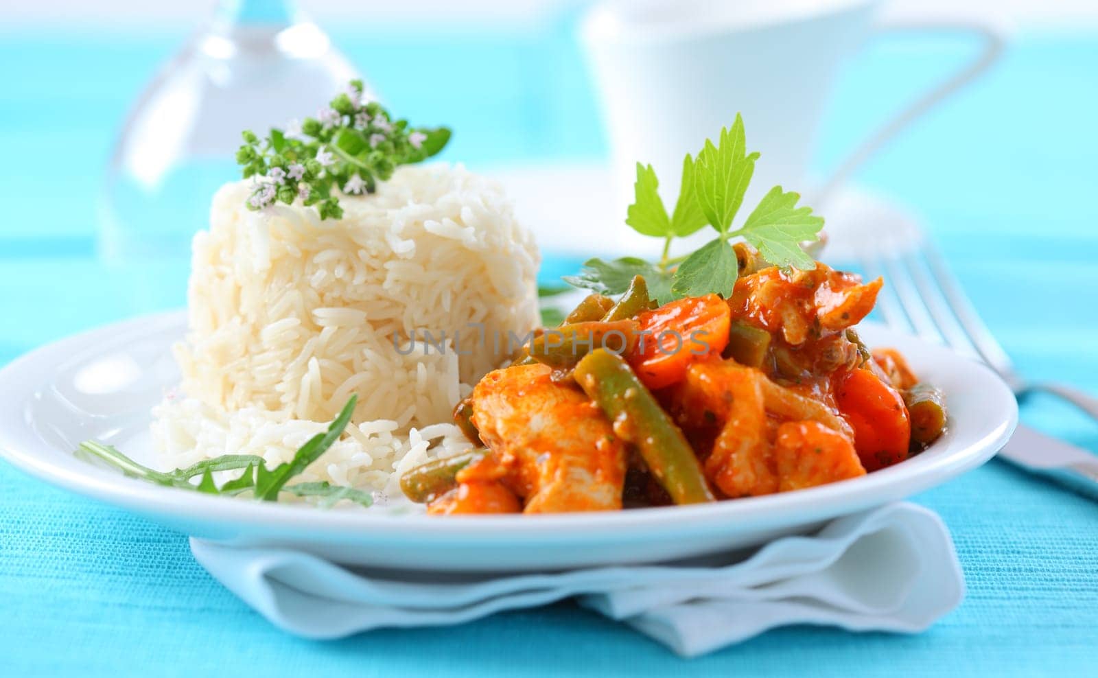Red chicken curry stripes with rice and vegetable