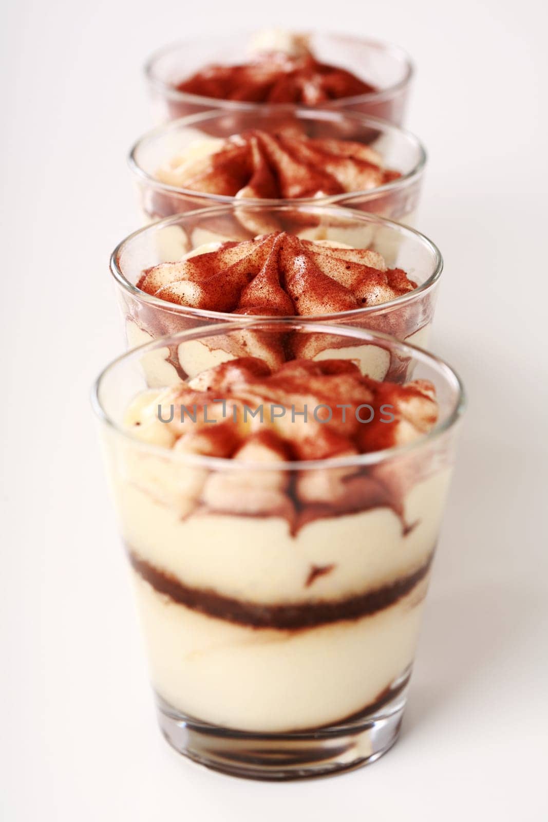 Three Tiramisu desserts in the cup