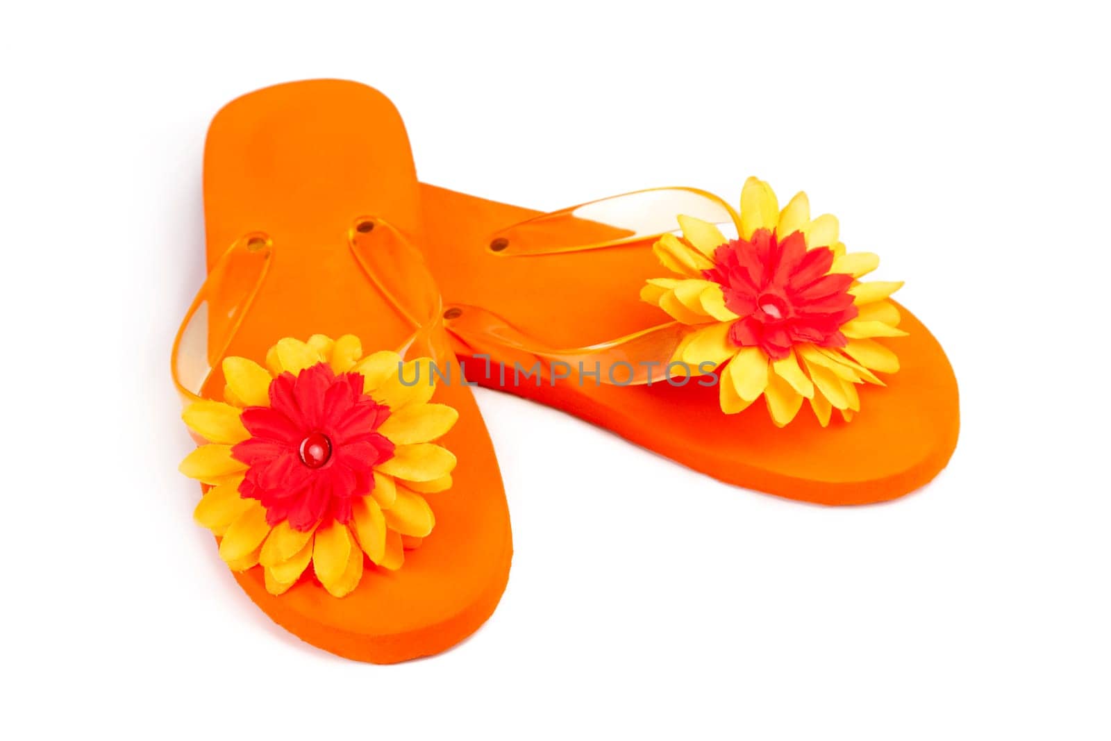orange flip-flops with flowers on a white background