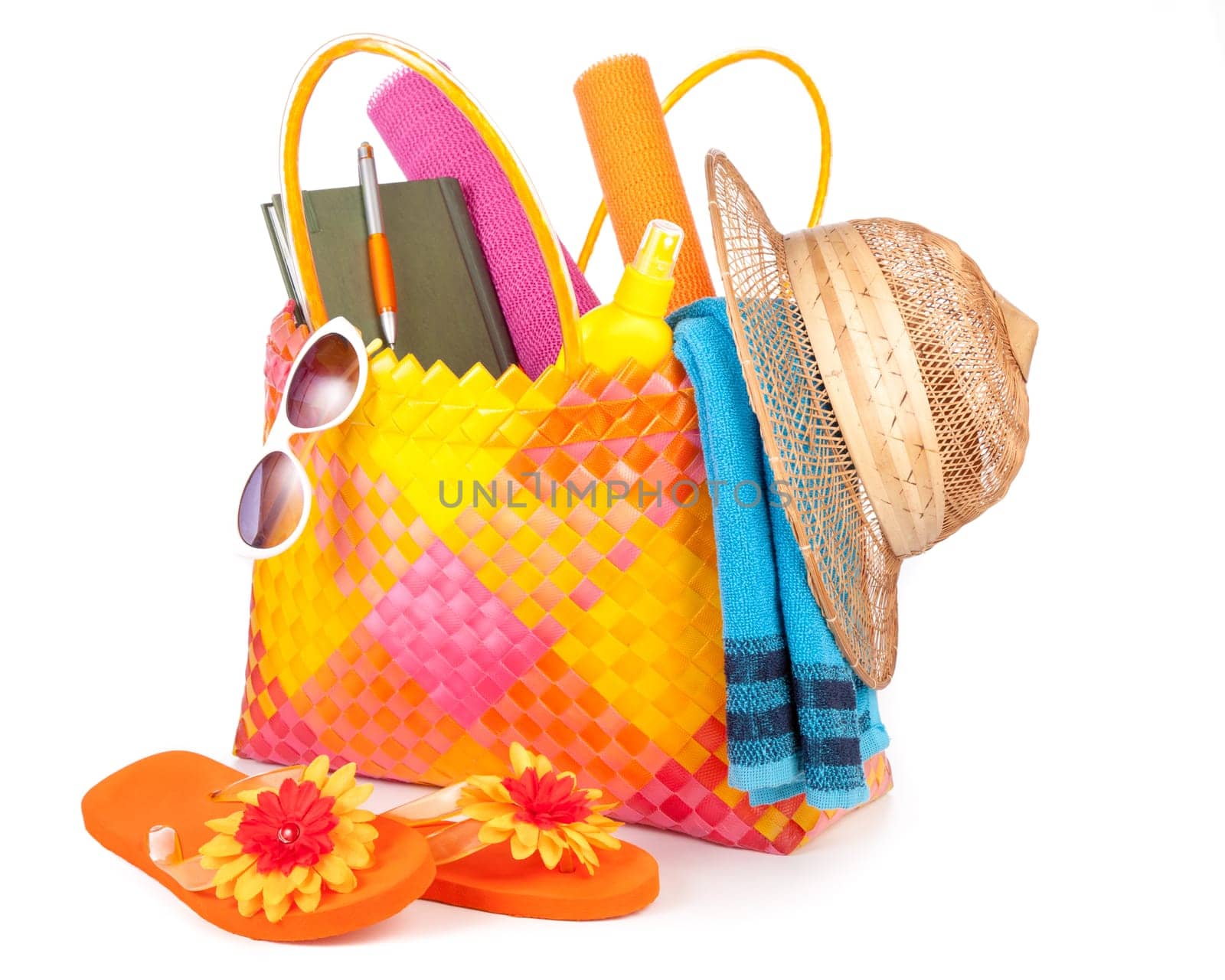 beach bag with towel sunglasses flip-flops and hat.isolated on white