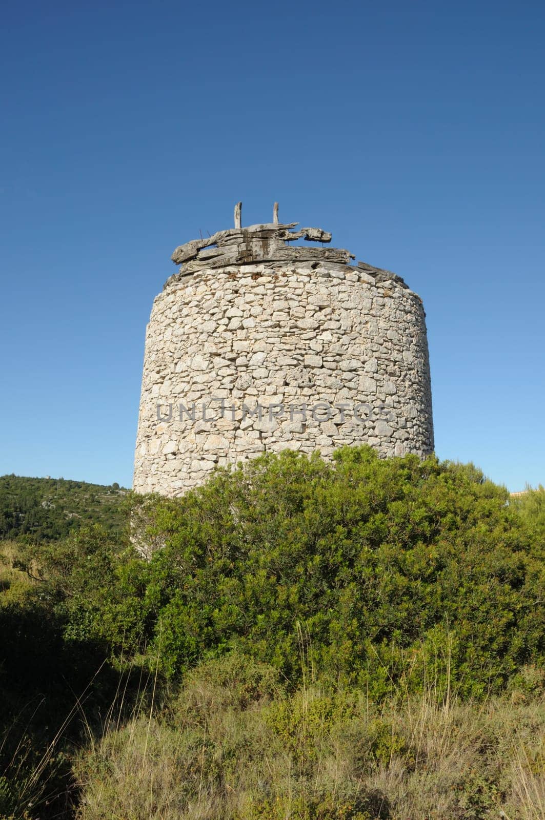 Old stone windmill ruins in Zakynthos, Greece.