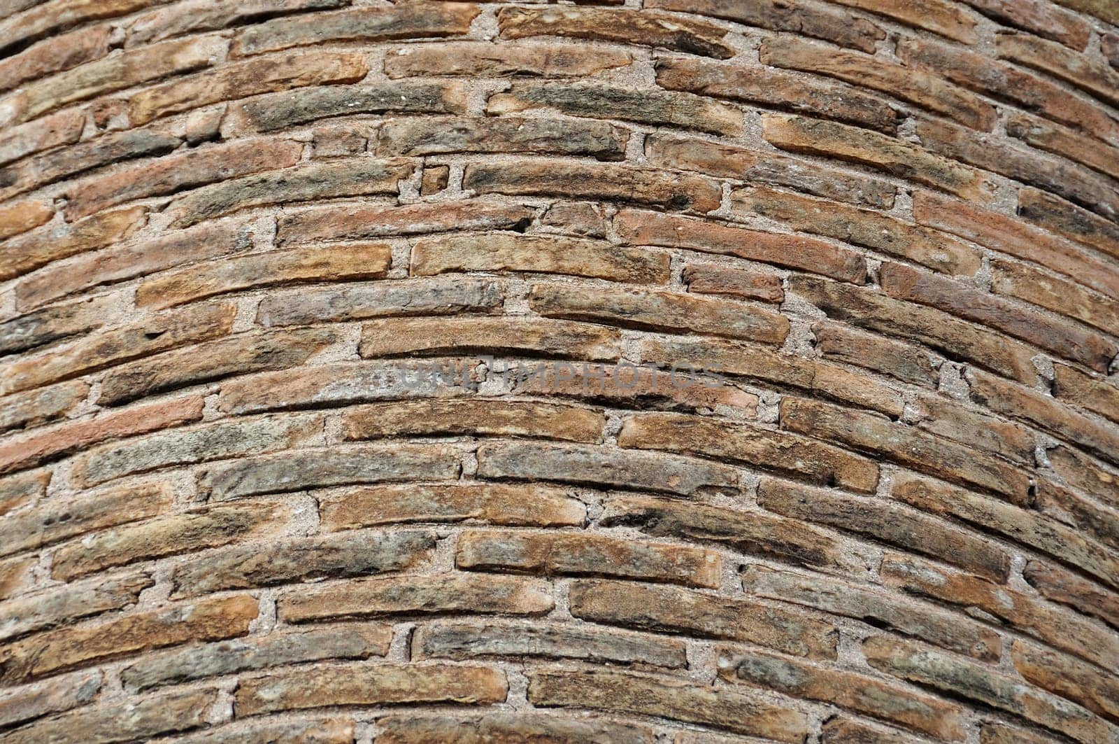 Detail of weathered factory brick chimney. Background texture.