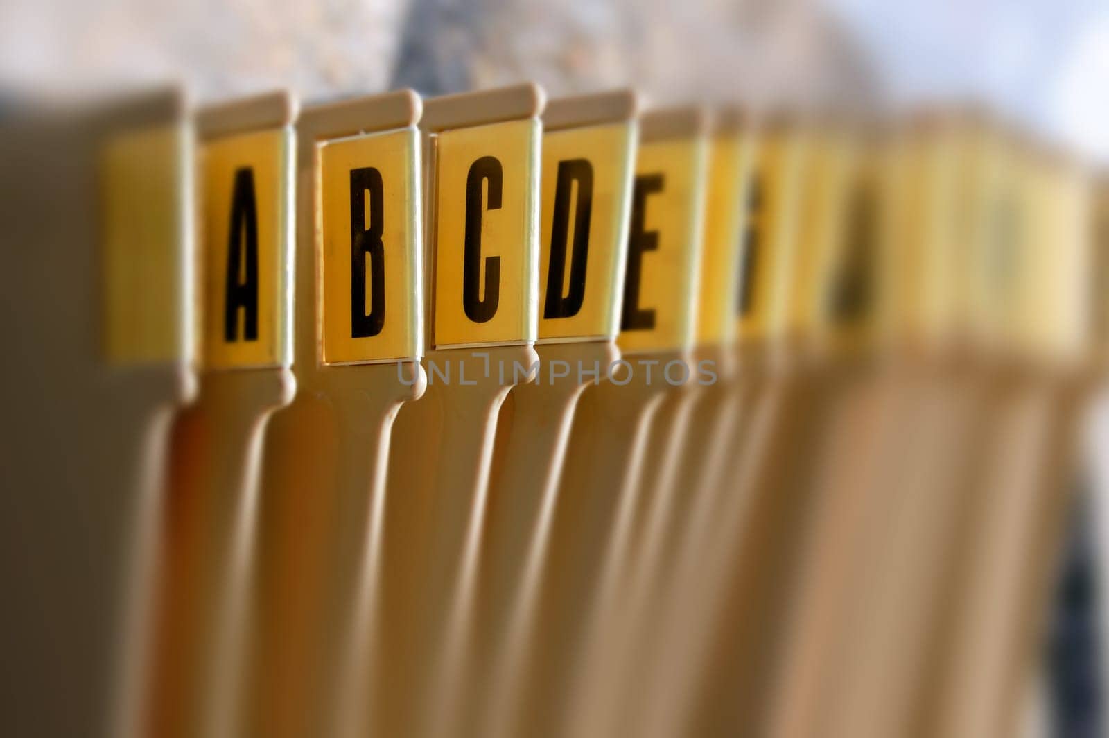 Alphabetical filing tray index office documents organizer. Selective focus.