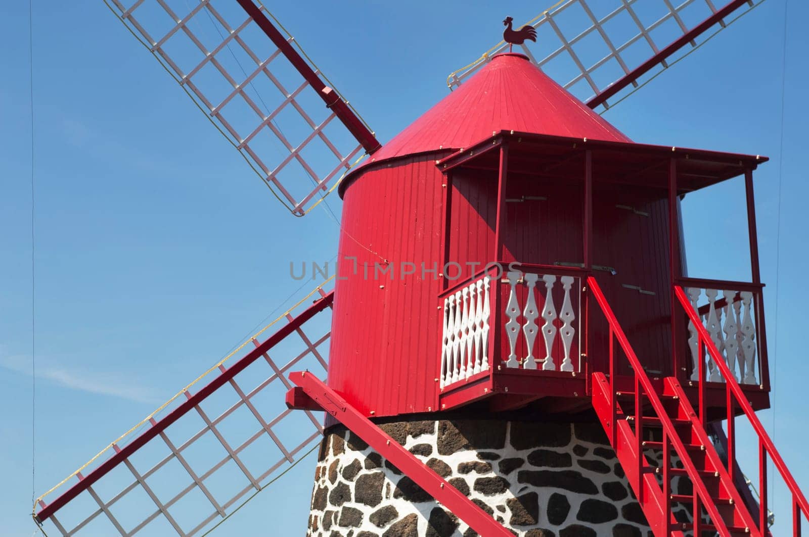 Red windmill in the coast of Pico island, Azores