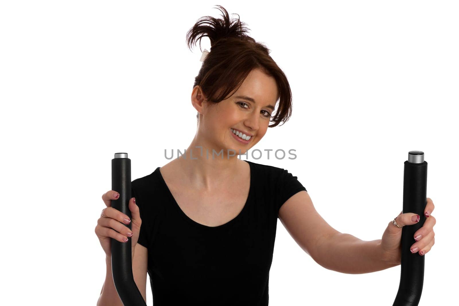 Young pretty woman exercising on a stepper