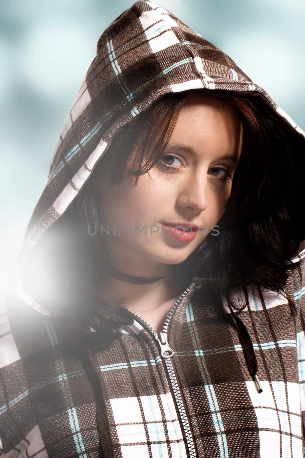 Portrait of a young pretty woman wearing a hooded shirt