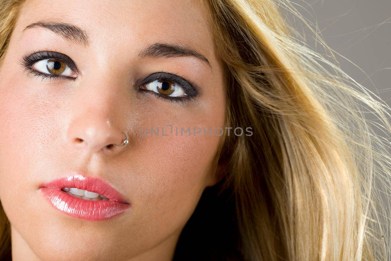 a portrait of a real beautiful young surprised girl