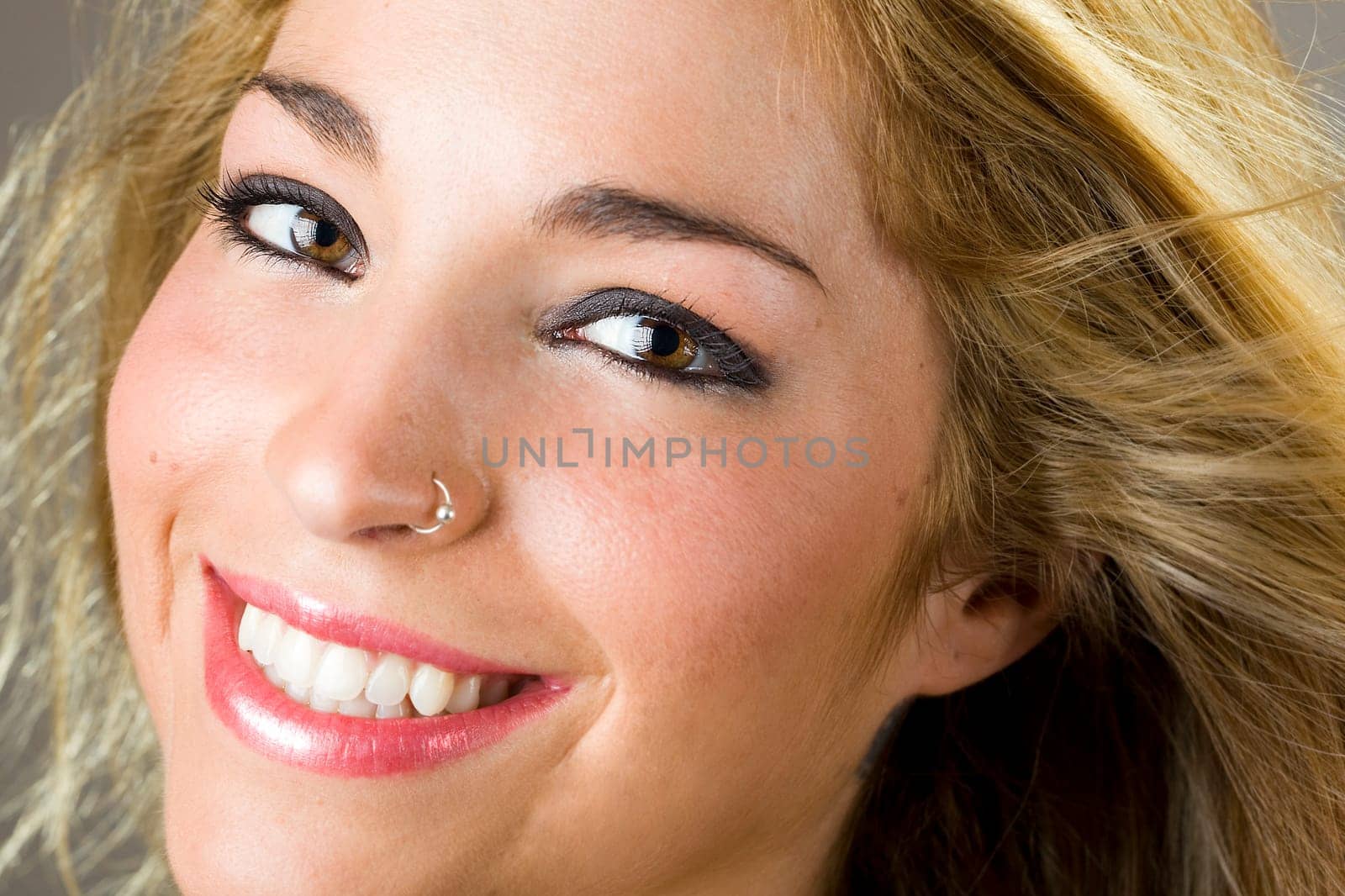 a portrait of a real beautiful young surprised girl