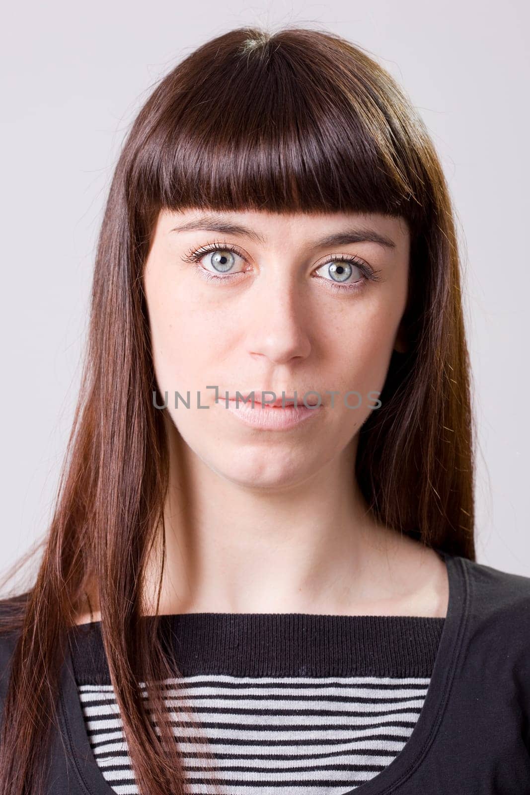 a portrait of a real beautiful young surprised girl
