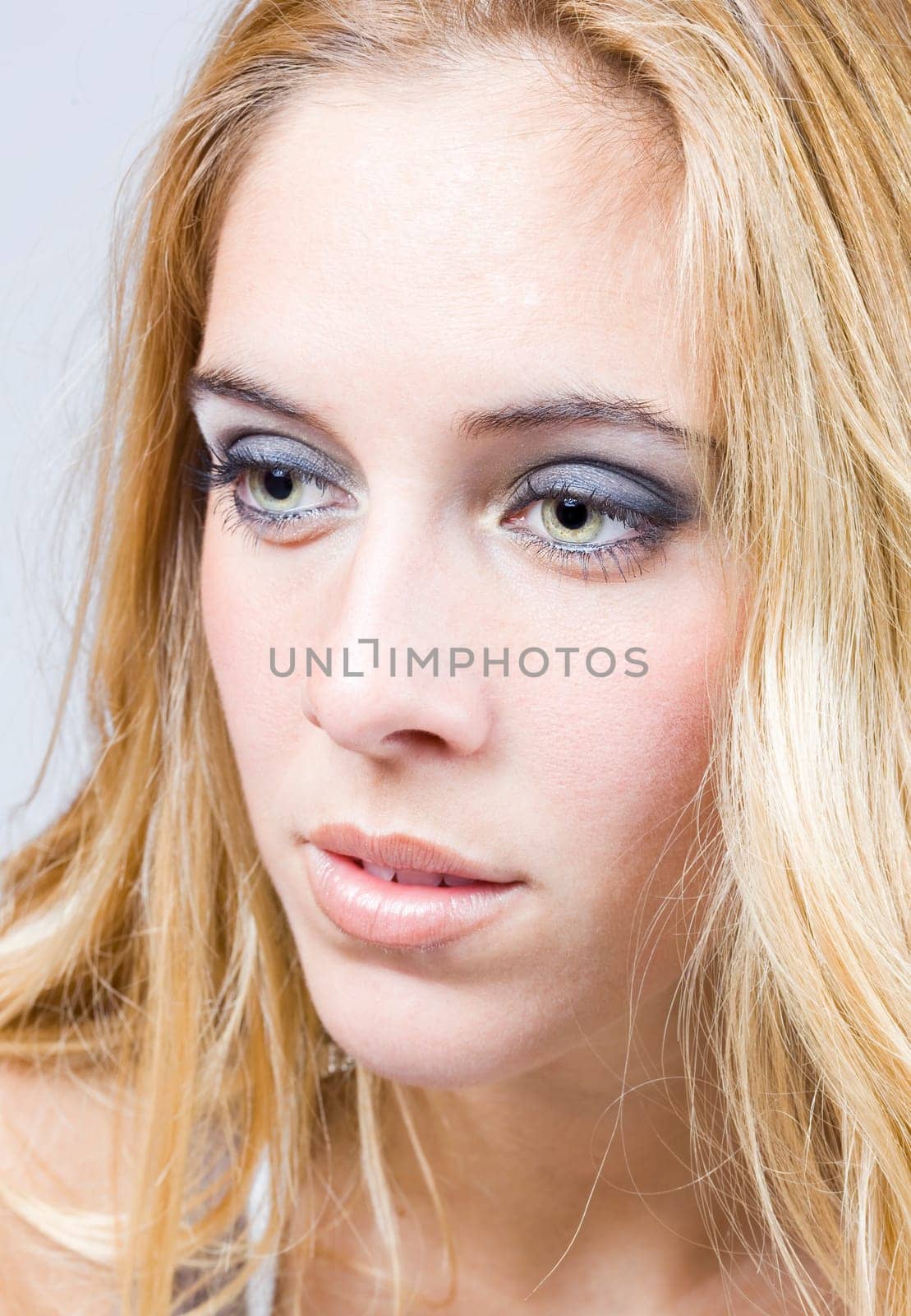 a portrait of a real beautiful young surprised girl