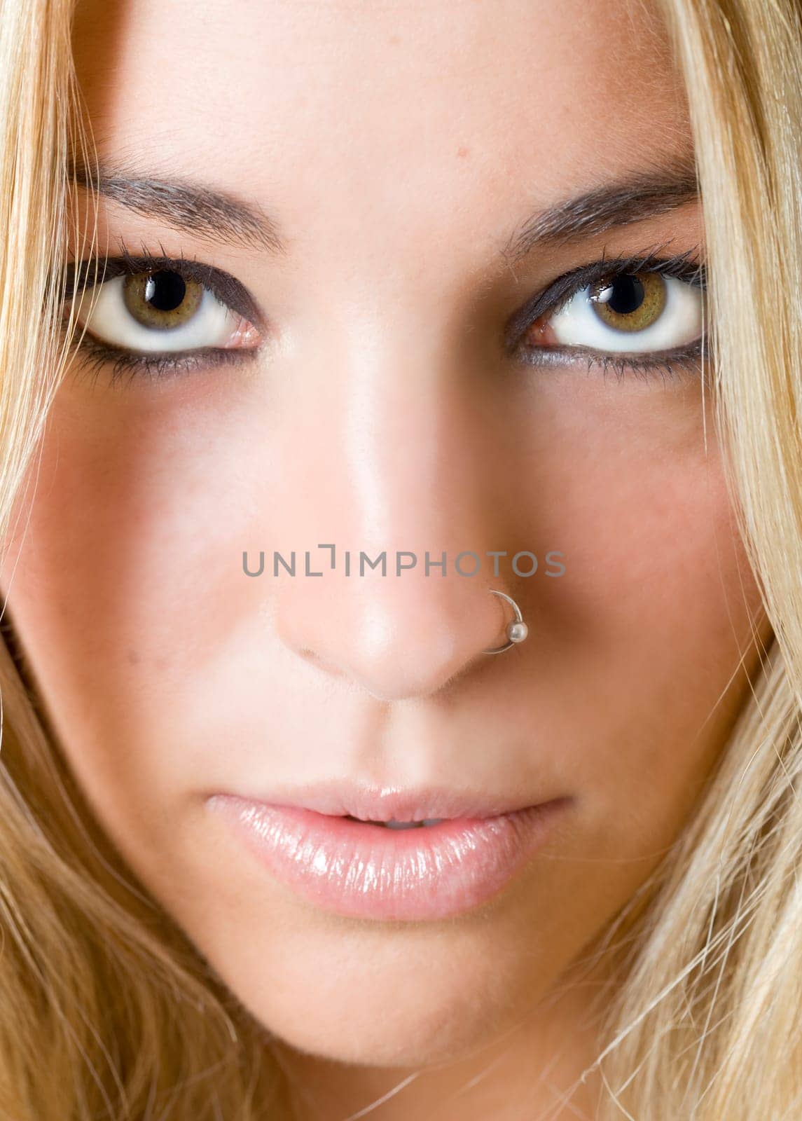 a portrait of a real beautiful young surprised girl