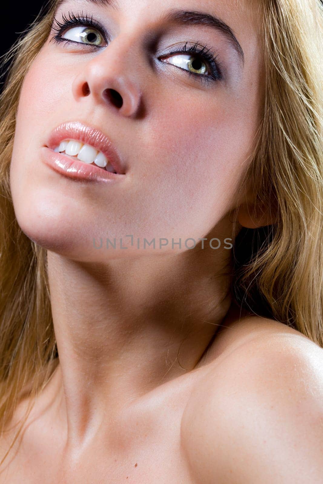 a portrait of a real beautiful young surprised girl