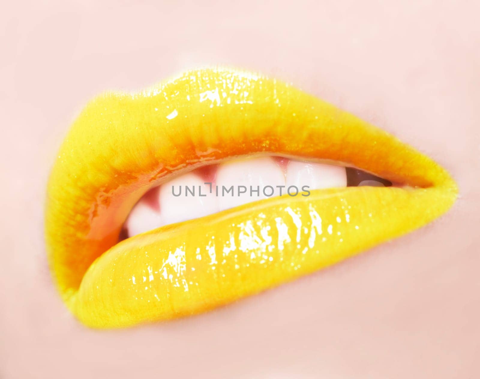 sexy woman lips with yellow make up and gloss