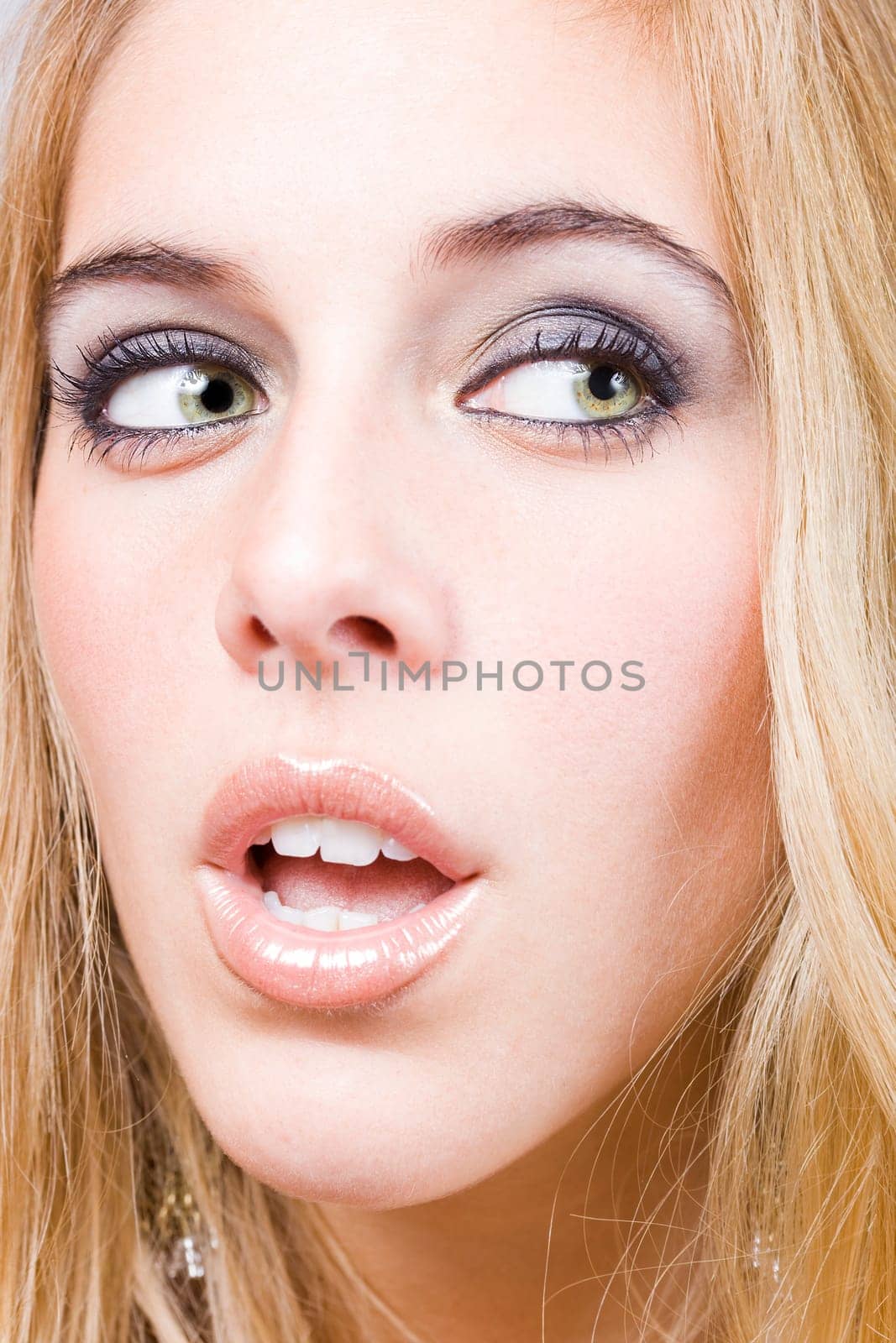 a portrait of a real beautiful young surprised girl