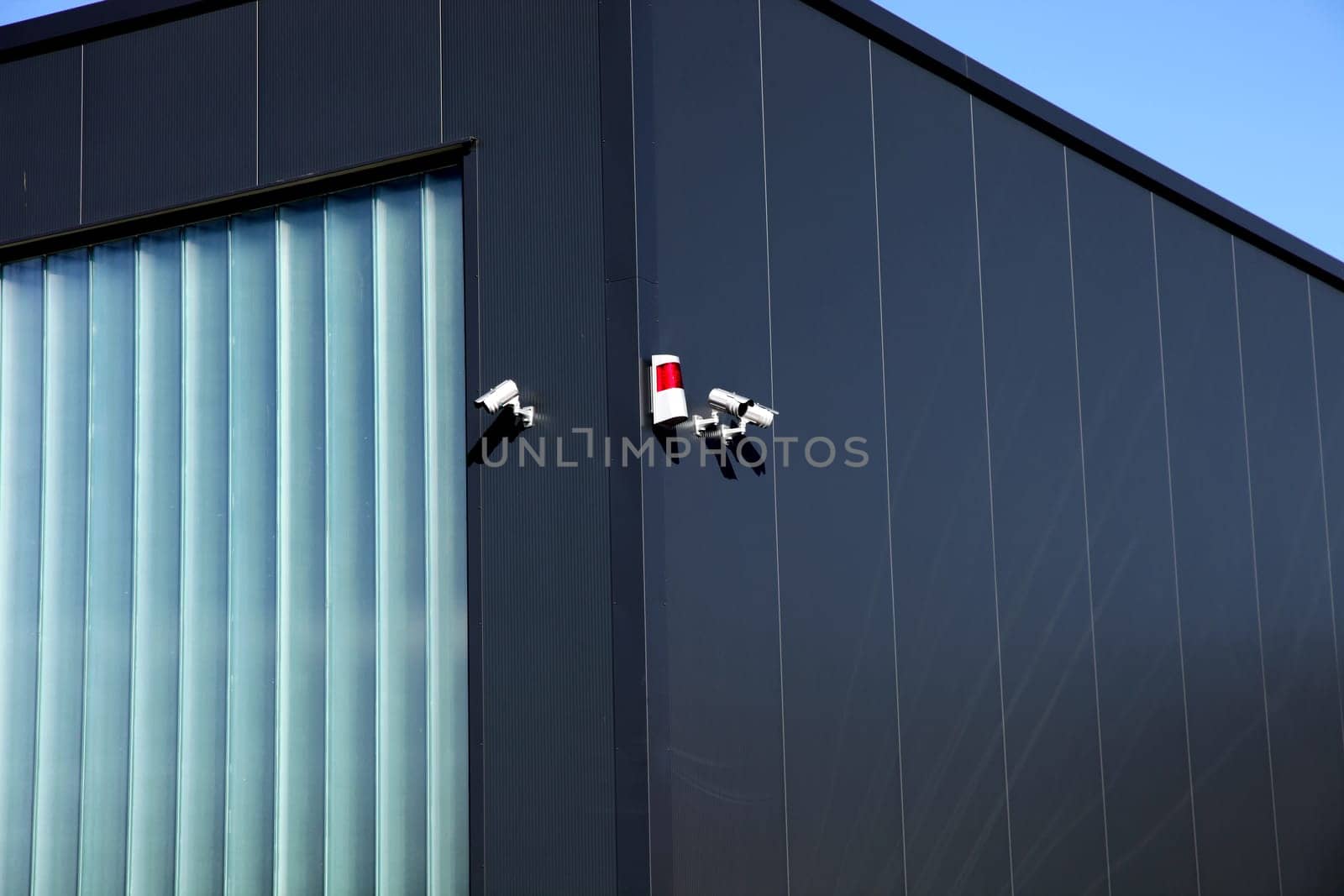 Security Camera And Alarm System At A Building Vertical