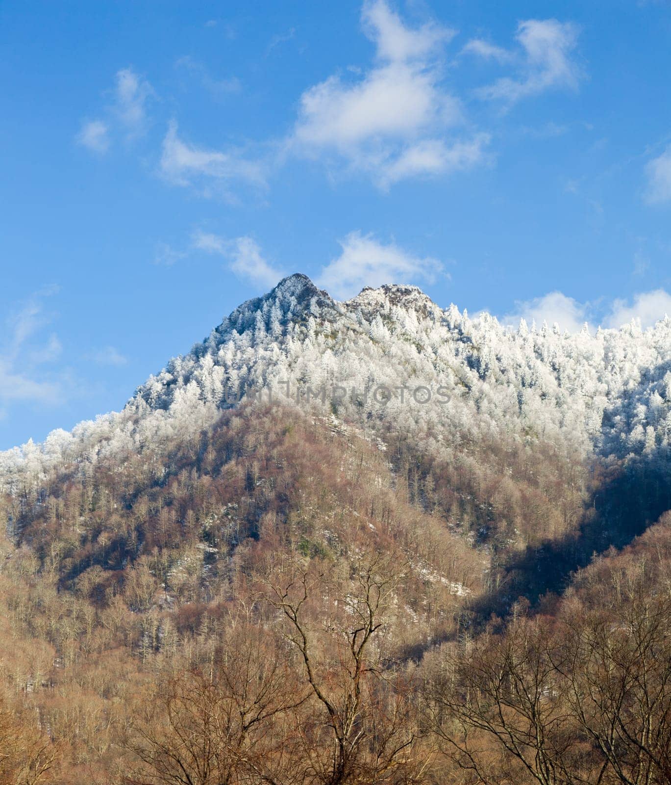 Famous Smoky Mountain view of Chimney Tops covered in snow in early spring