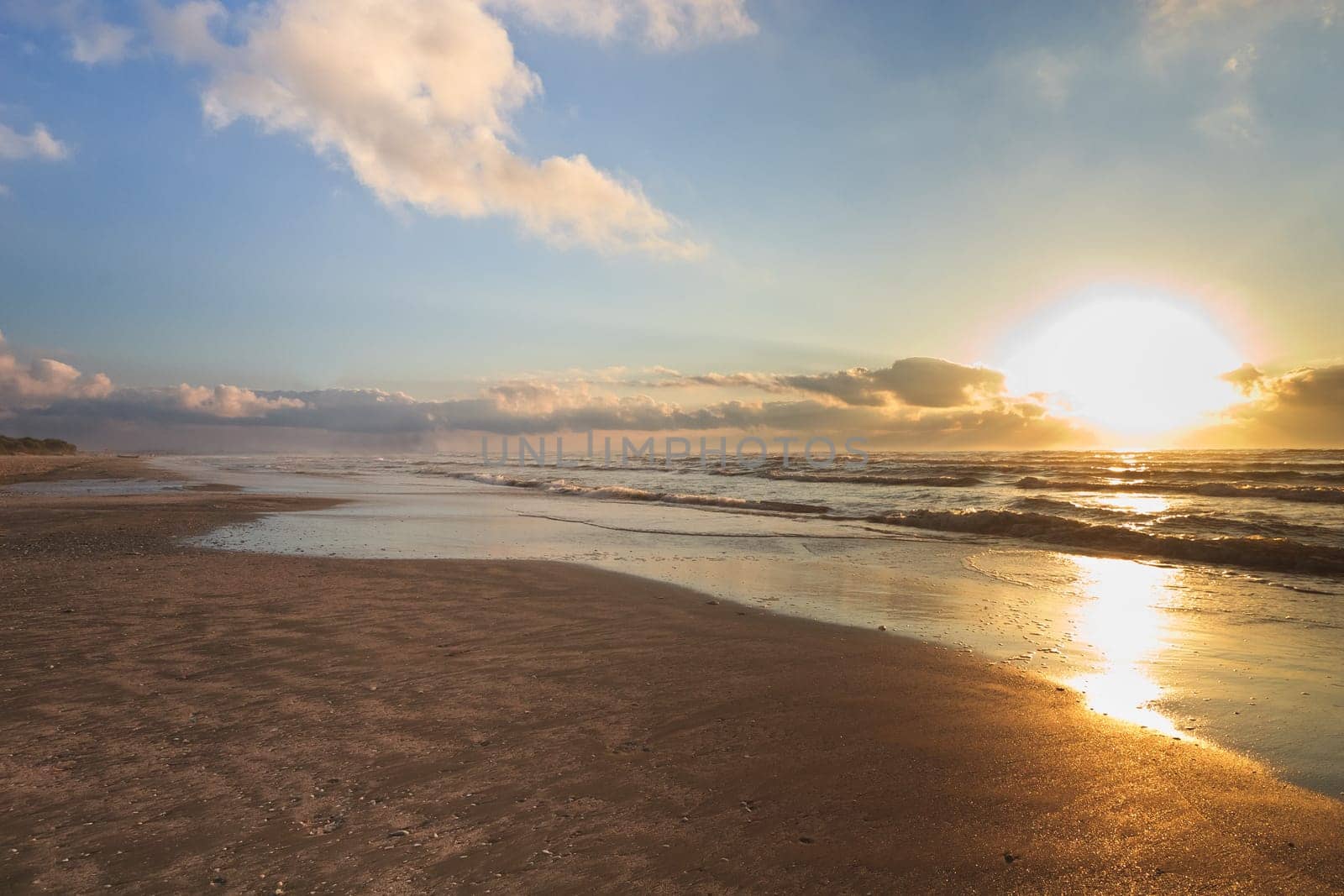 reflection of the sun at sunrise on the beach