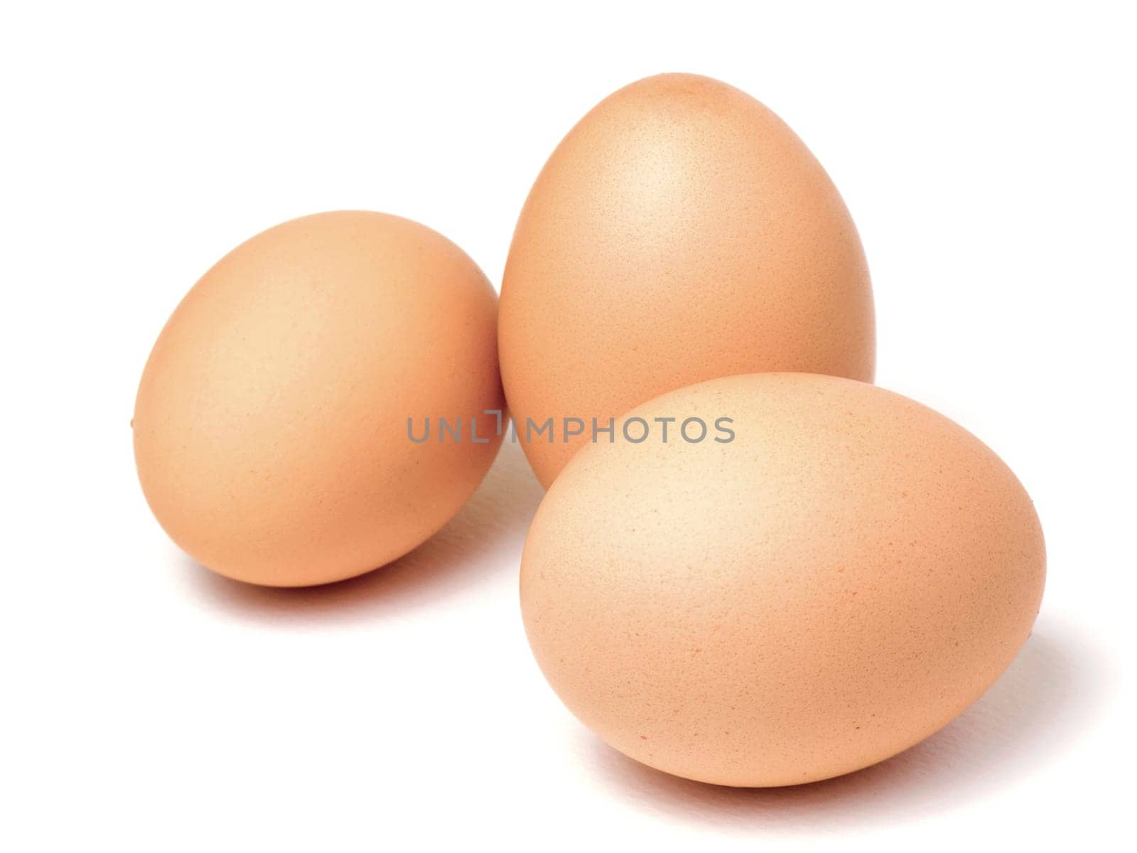 Three fresh eggs isolated on white background