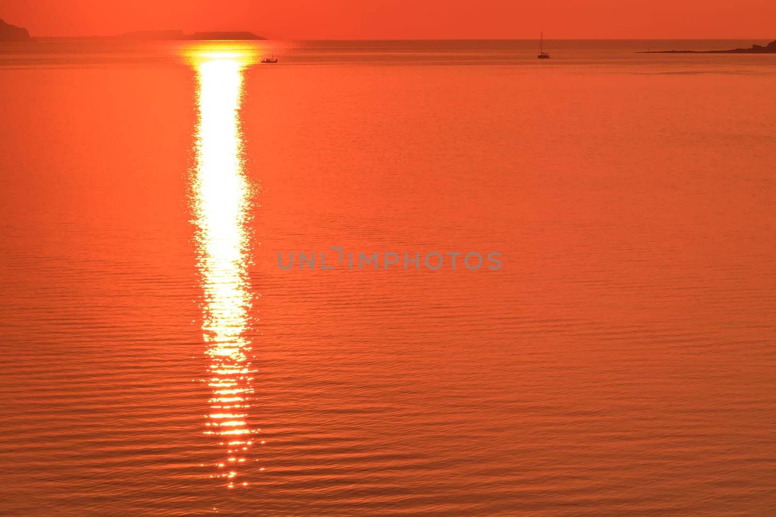 reflection of the sun at sunrise on sea