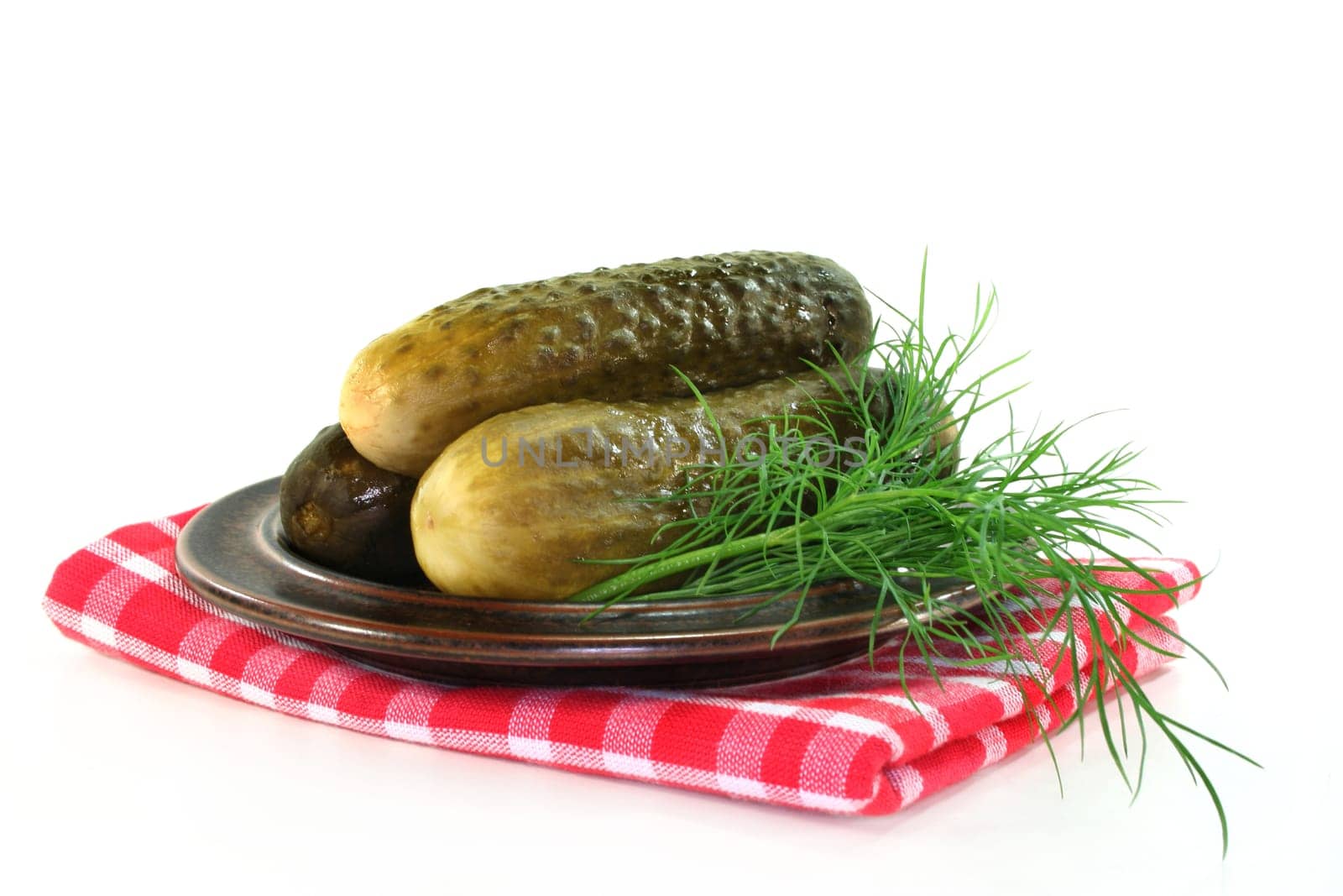Pickles and dill on a plate