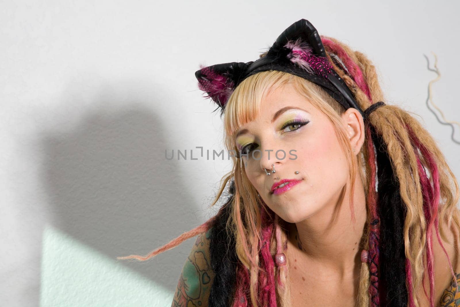 Portrait of a sexy young woman with tattoos