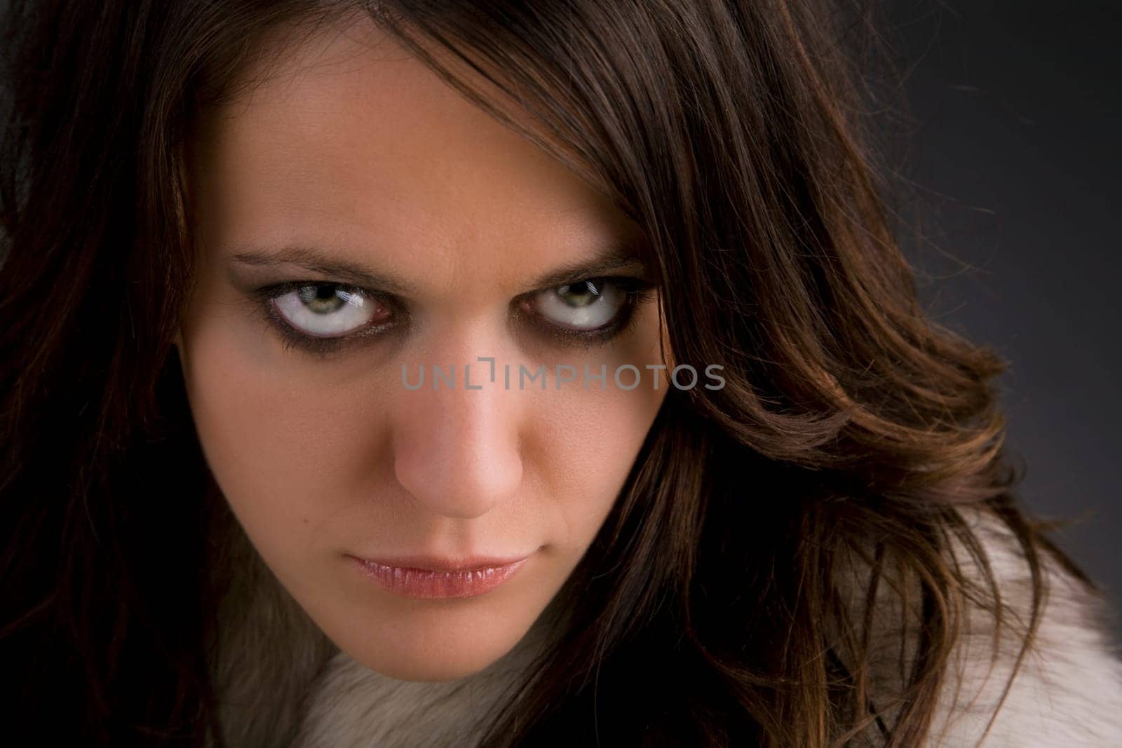 Portrait of a beautiful glamour model on dark grey background