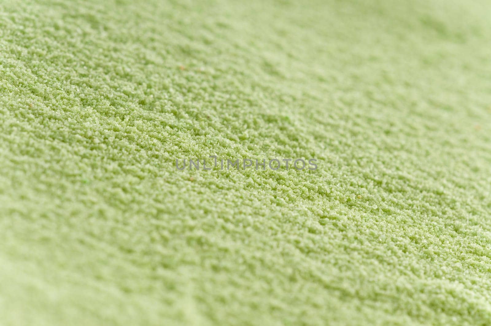 Close-up of green sand with oblique sharpness gradient