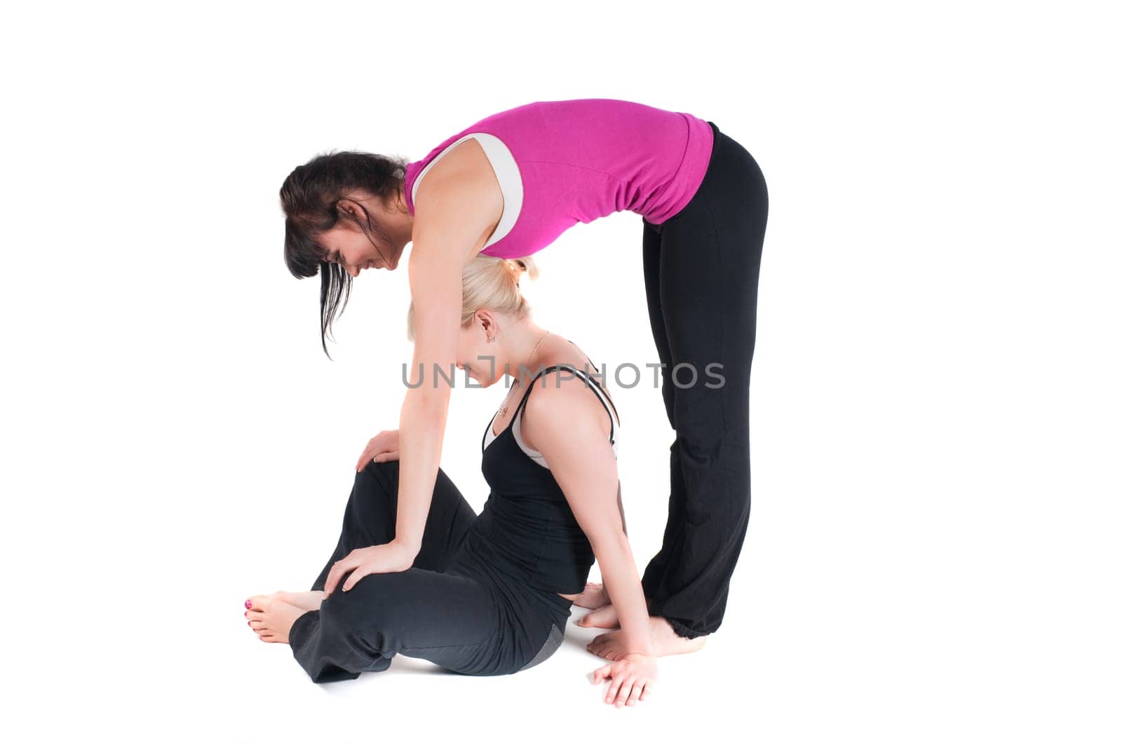 Shoot of two fitness instructors isolated on white