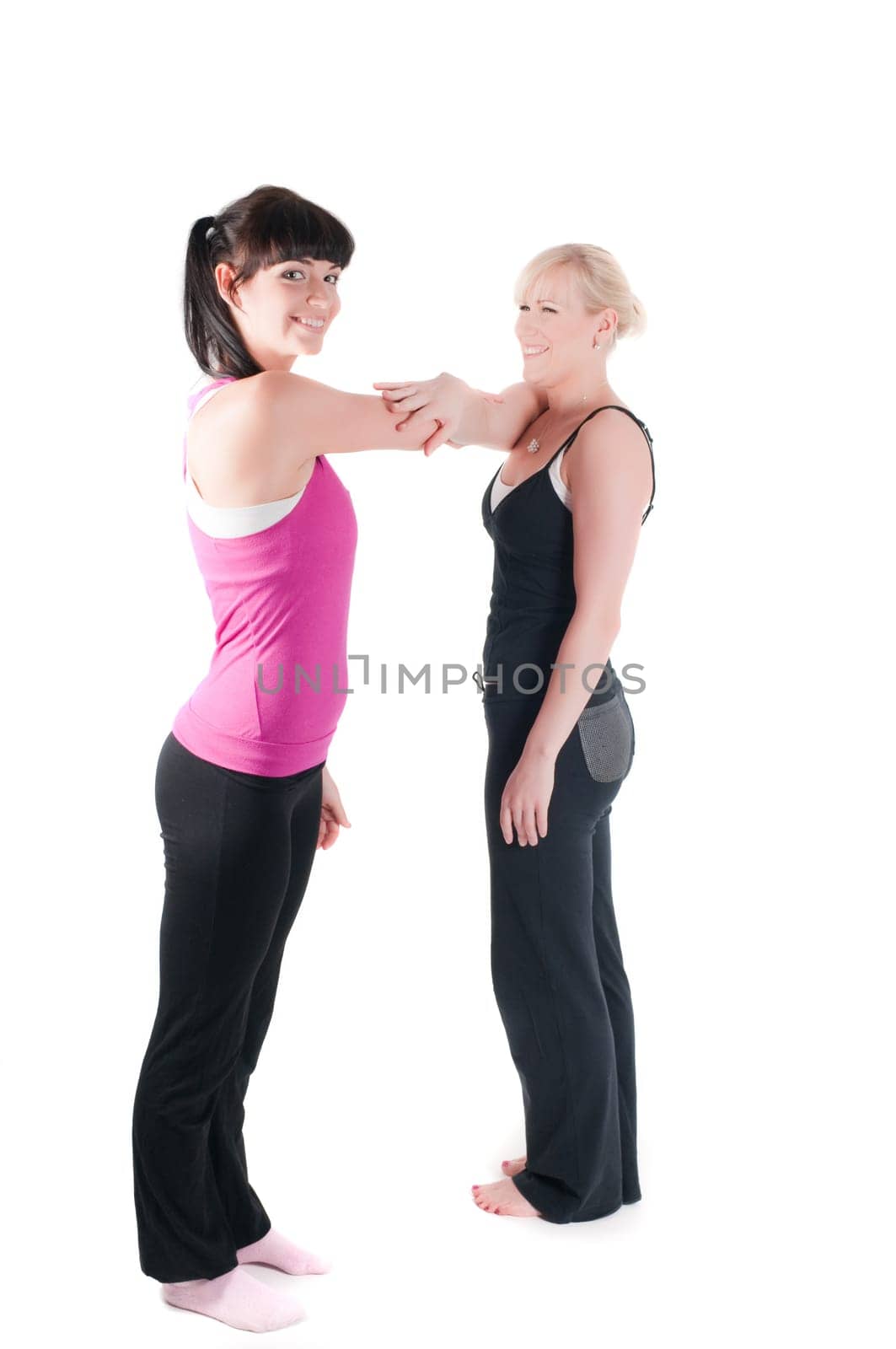 Shoot of two fitness instructors isolated on white