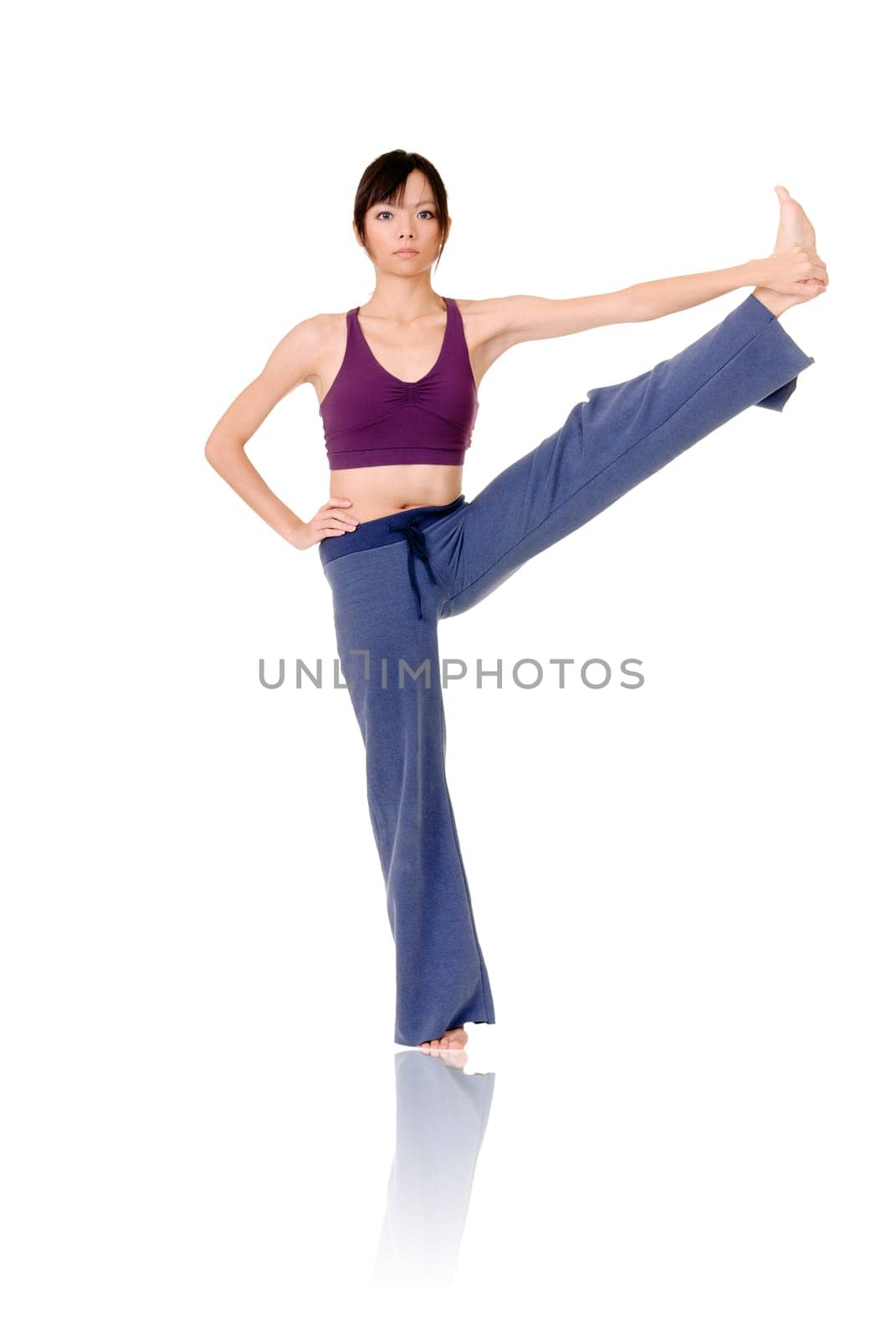 Asian woman of fitness doing expert yoga pose, full length portrait isolated on white background.