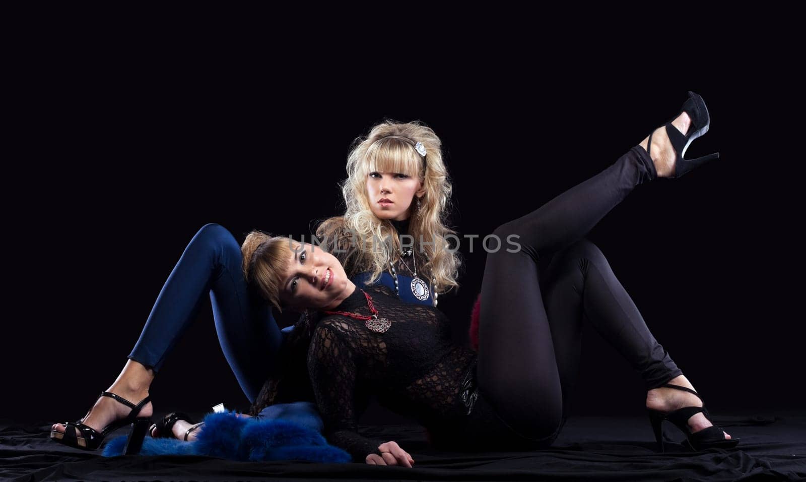 Two pretty sisters relax in lace costume