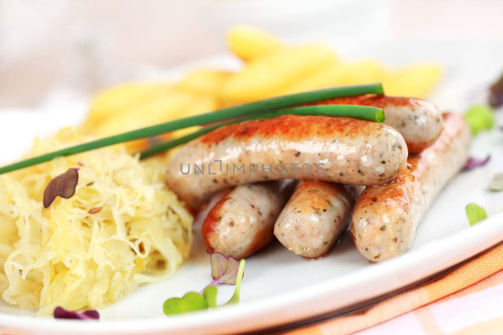 German traditional meal - White sausage with sour cabbage and rolled noodle with beer