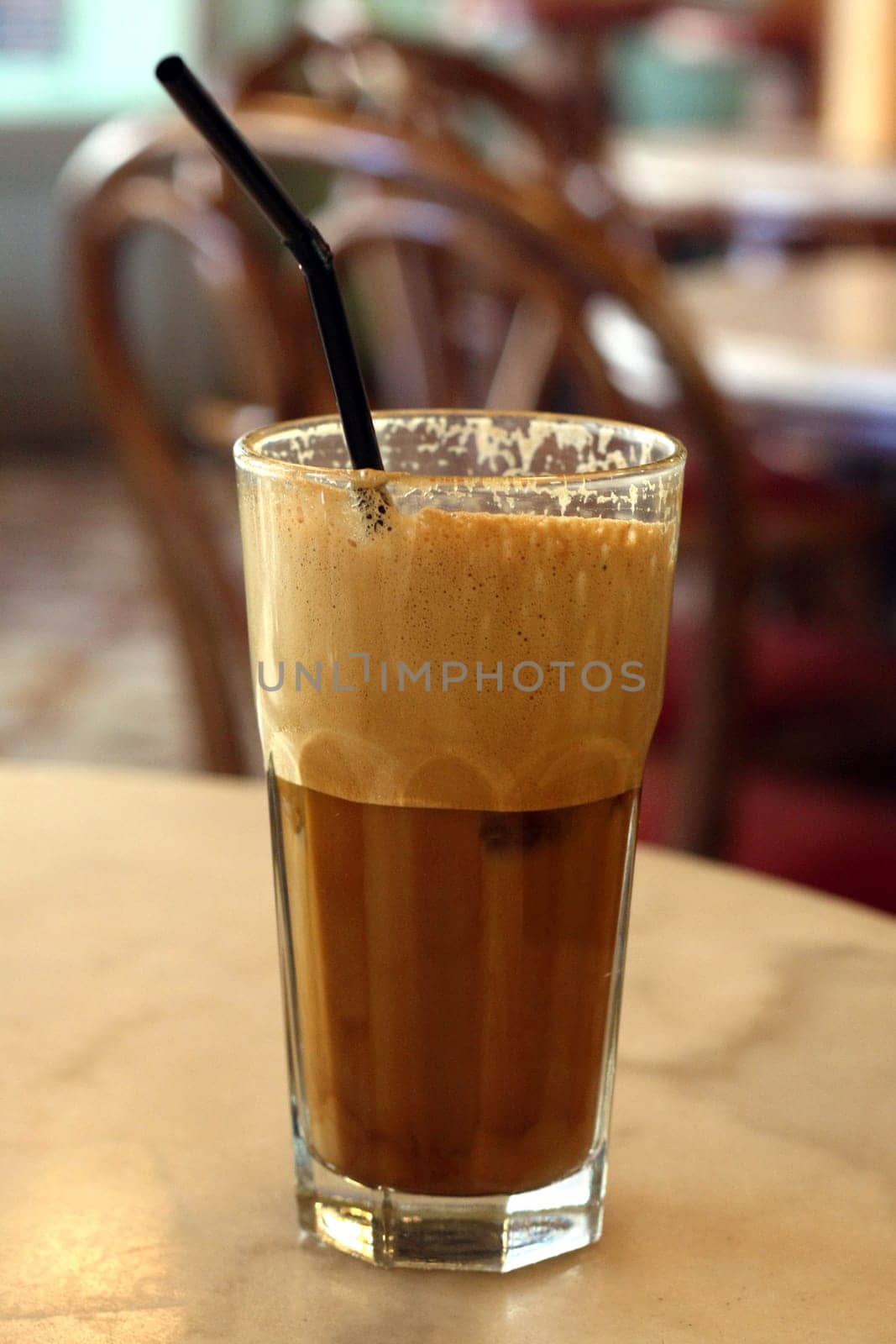 Greek coffee, cold Frape drink on a marble table