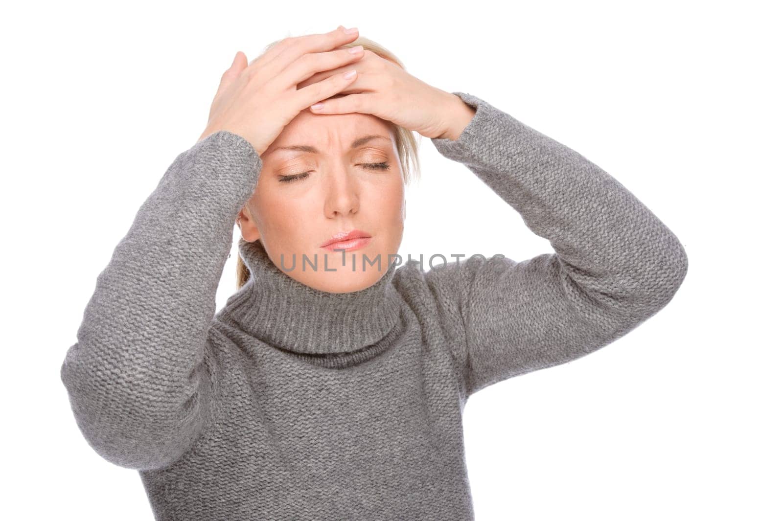 Studio shot of a young woman with a headache