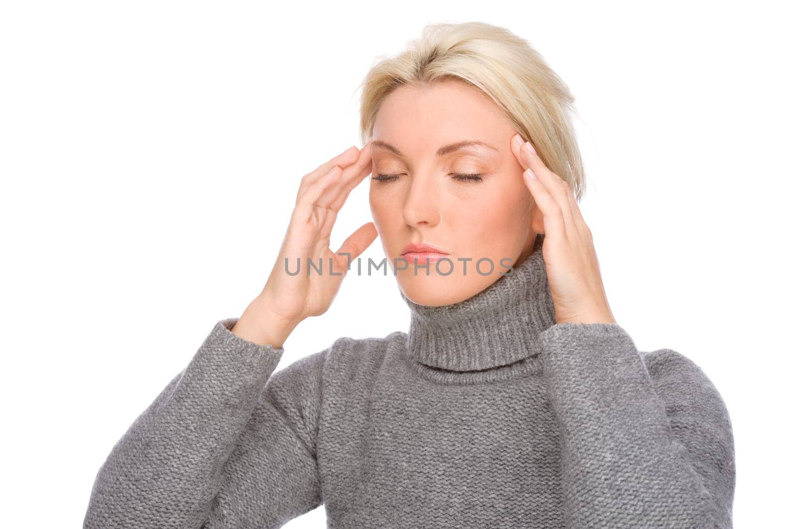 Studio shot of a young woman with a headache